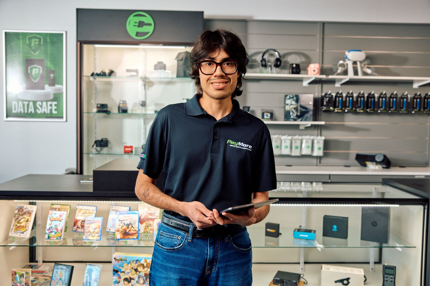 paymore employee holding a tablet and smiling